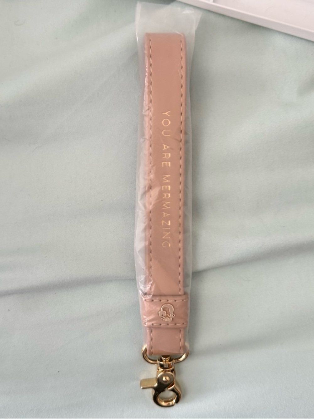 Spartina wristlet handle strap in beige 
Maybe a replacement for yours